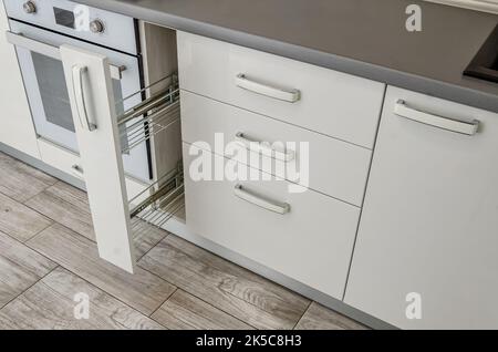 White kitchen set, bedside table with drawers. Stock Photo