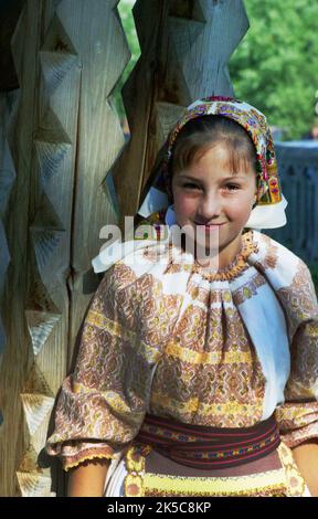 Maieru, Bistrița-Năsăud County, Romania, 2000. Young girl in beautiful traditional folk costume. Stock Photo
