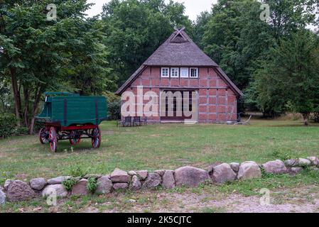 Half-timbered house, old horse carriage, Wilsede, Lüneburger Heide, Lower Saxony, Germany Stock Photo