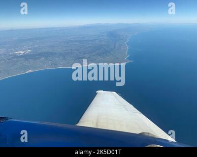 A research plane carrying the AVIRIS-NG (Airborne Visible/Infrared Imaging Spectrometer-Next Generation) instrument flies off the Central Coast of California near Point Conception and the Jack and Laura Dangermond Preserve on Feb. 24, 2022. The flight is part of the Surface Biology and Geology High-Frequency Time Series (SHIFT) campaign, which is jointly led by NASA's Jet Propulsion Laboratory, the University of California, Santa Barbara (UCSB), and The Nature Conservancy. Operating between late February and late May 2022, the aerial portion of SHIFT flies on an approximately weekly basis over Stock Photo