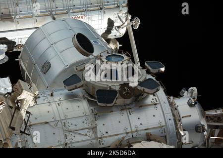 Expedition 66 Flight Engineer Thomas Marshburn of NASA and Commander Anton Shkaplerov of Roscosmos peer out from windows inside the cupola, the International Space Station's 'window to the world.' Stock Photo