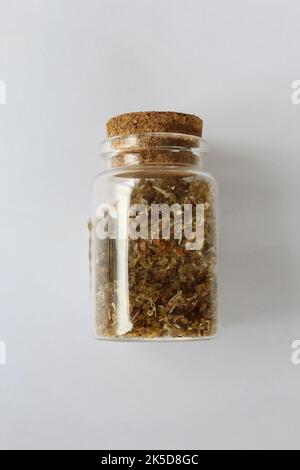 Natural aromatic incense musk in bottle isolated on a white background Stock Photo