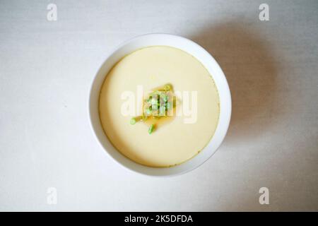 Steamed eggs. It’s a common homemade cuisine in many Asian countries like China, Taiwan, and Japan. Stock Photo