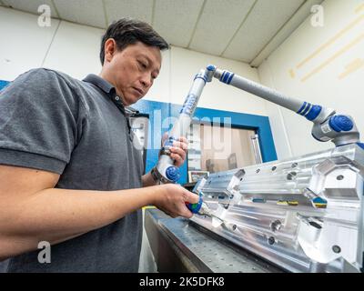 Parts for the Orion crew module which will carry astronauts on Artemis II are machined at Aerospace Engineering Corporation in California on June 18, 2018. Stock Photo