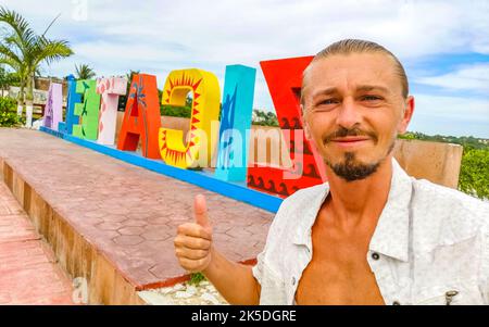 Traveler and Tourist at the colorful Zicatela Puerto Escondido