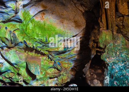 Inkaya Cave in Yelki, Guzelbahce. Colorful cave entrance with natural daylight. Stock Photo