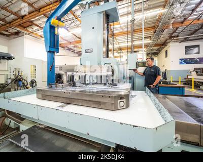 Parts for the Orion crew module which will carry astronauts on Artemis II are machined at Aerospace Engineering Corporation in California on June 18, 2018. Stock Photo