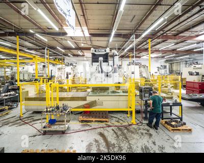 Parts for the Orion crew module which will carry astronauts on Artemis II are machined at Aerospace Engineering Corporation in California on June 18, 2018. Stock Photo