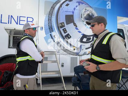 Boeing Recovery Director Bryan Gartner, left, and Boeing Starliner Launch Conductor Louis Atchison prepare for the landing of Boeing’s CST-100 Starliner spacecraft at White Sands Missile Range’s Space Harbor, Wednesday, May 25, 2022, in New Mexico. Boeing’s Orbital Flight Test-2 (OFT-2) is Starliner’s second uncrewed flight test to the International Space Station as part of NASA's Commercial Crew Program. OFT-2 serves as an end-to-end test of the system's capabilities. Stock Photo