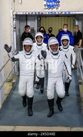 NASA’s SpaceX Crew-4 astronauts – from front, left to right – Bob Hines, Kjell Lindgren, Jessica Watson, and Samantha Cristoforetti walk out through the double doors below the Neil A. Armstrong Building’s Astronaut Crew Quarters at NASA’s Kennedy Space Center in Florida for a dry dress rehearsal on April 20, 2022. SpaceX’s Falcon 9 rocket and Crew Dragon, named Freedom by the Crew-4 crew, will launch the astronauts to the International Space Station as part of NASA’s Commercial Crew Program. Liftoff is targeted for 5:26 a.m. EDT on Saturday, April 23, 2022, from Launch Complex 39A at Kennedy. Stock Photo