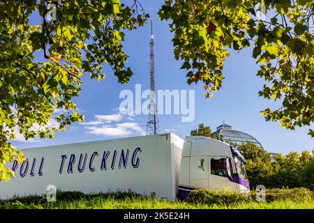 Beautiful Rock N Roll truck is seen here parked in the foreground of London's famous Alexandra Palace and Iconic Transmitter Tower Stock Photo
