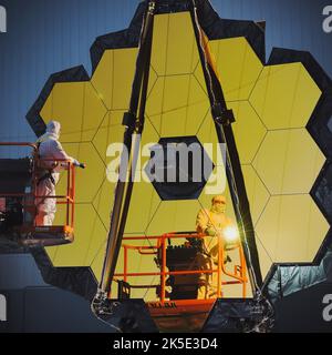 Preparing the James Webb Space Telescope (JWST). NASA technicians working on the JWST complete the first important optical measurement of Webb's fully assembled primary mirror, called a Center of Curvature test.These tests will simulate the violent sound and vibration environments the telescope will experience inside its rocket on its way out into space. An optimised version of a NASA image by experienced lead photographer Chris Gunn. Credit: NASA/Chris Gunn. For editorial use only.
