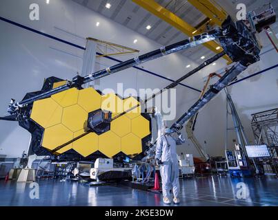 Following a successful deployment test of NASA Webb's mission-critical secondary mirror, technicians and engineers visually inspect the support structure that holds it in place. In order to do groundbreaking science, NASA's James Webb Space Telescope must first perform an extremely choreographed series of deployments, extensions, and movements that bring the observatory to life shortly after launch. An optimised version of a NASA image by experienced lead photographer Chris Gunn. Credit: NASA/Chris Gunn. For editorial use only.