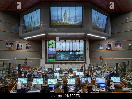 Launch teams monitor the countdown to the launch of the Ariane 5 rocket carrying the James Webb Space Telescope, 25 December 2021, in the Jupiter Center at the Guiana Space Center in Kourou, French Guiana. The James Webb Space Telescope (sometimes called JWST or Webb) is a large infrared telescope with a 21.3 foot (6.5 meter) primary mirror. The observatory will study every phase of cosmic history - from within our solar system to the most distant observable galaxies in the early universe. Image by senior NASA photographer Bill Ingalls / Credit B.Ingalls/NASA. Editorial Use only