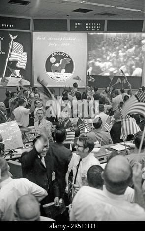 At 16:18 EDT on 20 July 1969, the lunar module lands with only 30 seconds of fuel remaining. Neil Armstrong radios, 'Houston, Tranquility Base here. The Eagle has landed.' Mission control erupts in celebration. As the tension breaks, Charlie Duke, then sitting at the CapCom console, tells the crew, 'Roger, Tranquility. We copy you on the ground. You got a bunch of guys about to turn blueÑwe're breathing again. Thanks a lot.' An optimised NASA image: Credit: NASA Stock Photo