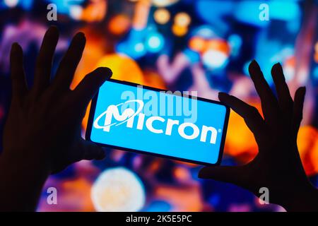 In this photo illustration, the Micron Technology, Inc. logo is displayed on a smartphone screen. Stock Photo