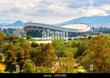 Landscape of Piraeus, Athens, Greece. Scenic view of the Peace and Friendship Stadium on mountain background in summer. Theme of sport, landmark, tour Stock Photo