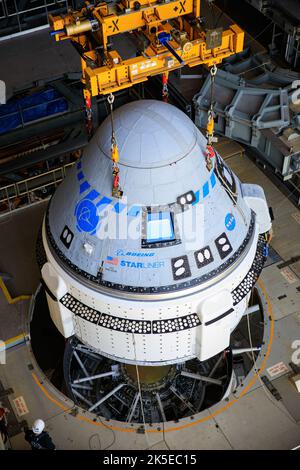 The Boeing CST-100 Starliner spacecraft is lifted at the Vertical Integration Facility at Space Launch Complex-41 at Florida's Cape Canaveral Space Force Station on May 4th, 2022. Starliner will be secured atop a United Launch Alliance Atlas V rocket for Boeing's second Orbital Flight Test (OFT-2) to the International Space Station for NASA's Commercial Crew Program. The spacecraft rolled out from Boeing's Commercial Crew and Cargo Processing Facility at NASA's Kennedy Space Center earlier in the day. Stock Photo