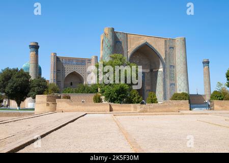 View of the Bibi-khanum (1404) medieval madrasah on a sunny September day. Samarkand, Uzbekistan Stock Photo
