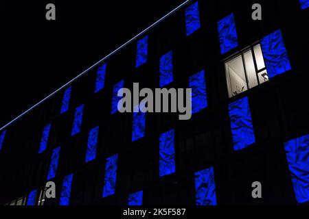 A bright window on a blue facade Stock Photo