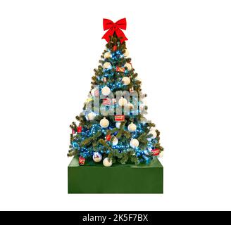 Beautiful christmas tree with a bright red bow on the top isolated on white background. Stock Photo