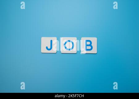 Word JOB on blue background,Job Concept Stock Photo