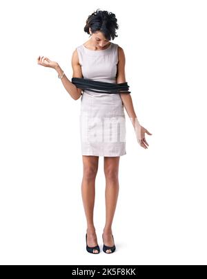 Bound by corporate conformity. Studio shot of a businesswoman tied up with ropes against a white background. Stock Photo