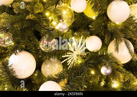 white ball, Christmas decorations and toys on the Christmas tree Stock Photo