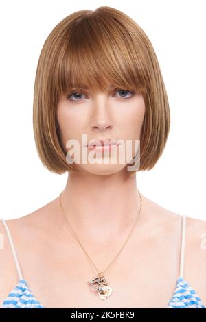 Young ginger serious woman thinking and looking aside isolated over ...