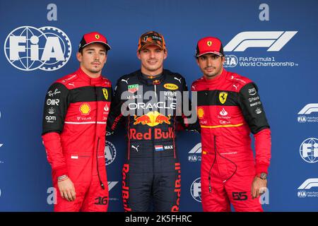 Suzuka, Japan. 8th Oct, 2022. Ferrari's Monegasque driver Charles Leclerc, Red Bull Racing's Dutch driver Max Verstappen and Ferrari's Spanish driver Carlos Sainz (L to R) pose for photos after the qualifying session of the Formula One Japan Grand Prix held at the Suzuka Circuit in Suzuka City, Japan, on Oct. 8, 2022. Credit: Zhang Xiaoyu/Xinhua/Alamy Live News Stock Photo