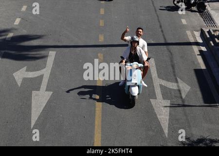 Fethiye daily life, people rides scooter at Ataturk caddesi. Stock Photo