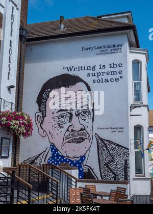 'Writing is the supreme solace' wall art with portrait of Somerset Maugham', 'The Peter Cushing', a Wetherspons public house in Whitstable, Kent, UK. Stock Photo