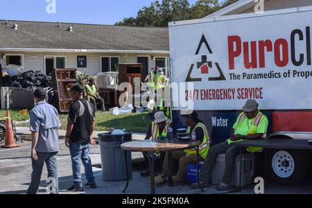 Kissimmee, USA. 07th Oct, 2022. Emergency clean-up and repair crews are seen at the Kissimmee Homes Apartments in Kissimmee, Florida. Most of the apartments suffered substantial flood damage from Hurricane Ian and residents were ordered to evacuate their homes by today so that work crews can begin the clean up and repair process. Credit: SOPA Images Limited/Alamy Live News Stock Photo