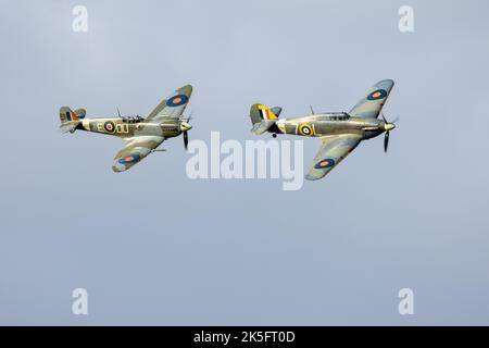 Supermarine Spitfire 'AR501' & Hawker Sea Hurricane “Z7015” flying in formation at the Race Day Airshow held at Shuttleworth on the 2nd October 2022 Stock Photo