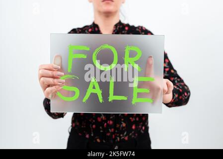 Hand writing sign For Sale. Word Written on putting property house vehicle available to be bought by others Stock Photo