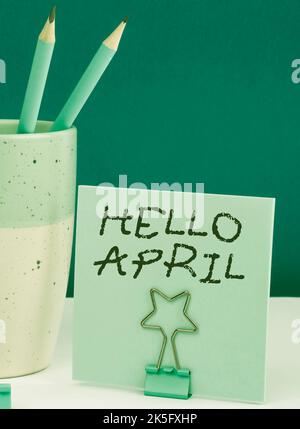 Text caption presenting Hello April. Business concept a greeting expression used when welcoming the month of April Stock Photo