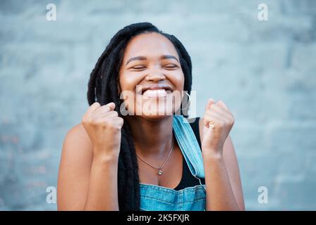 Black woman, happy and excited smile of a winner from Jamaica feeling happiness. Smiling face of a person with excitement, positive energy and Stock Photo