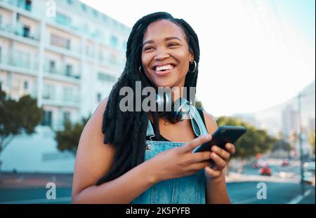 Student, street and happy girl with smartphone enjoying leisure break on weekend in Los Angeles. Black woman hipster with smile on commute with phone Stock Photo