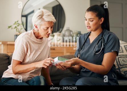 Home, healthcare and doctor help elderly patient in assisted living care facility, explain medicine on a sofa. Support, pills and senior care checkup Stock Photo