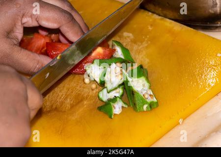 Closeup Image Of Woman Hands Cutting Vegetables In The Kitchen Stock Photo