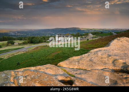 The Cow & Calf Hotel & Rocks (inn on high picturesque hill, moorland crag, bracken, purple heather moors, ) - Ilkley Moor, West Yorkshire, England UK. Stock Photo