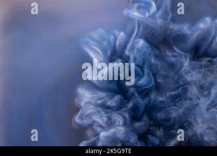Abstract fluid acrylic painting. Marbled blue abstract Ink cloud on background. Liquid marble pattern. Modern art.  Stock Photo