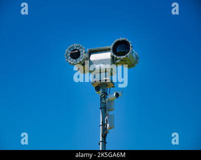 Remote controlled mobile surveillance cameras at the top of a tall mast at Dover point out across the English Channel. Taken on a sunny day in summer Stock Photo