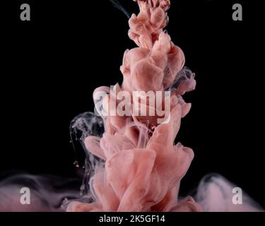 Abstract fluid acrylic painting. Marbled pink abstract Ink cloud on black background. Liquid marble pattern. Modern art.  Stock Photo