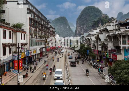 Yangshuo, China.  Street Scene, Karst Landscape in Background. Stock Photo