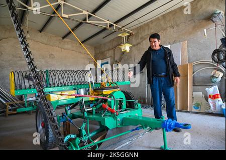 Hohhot, China's Inner Mongolia Autonomous Region. 8th Sep, 2022. Ting Bater checks tools in Sarultuya Village of Abag Banner, north China's Inner Mongolia Autonomous Region, Sept. 8, 2022. TO GO WITH 'Profile: Herder devoted to improving life through grassland conservation' Credit: Liu Lei/Xinhua/Alamy Live News Stock Photo