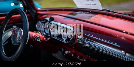 NISSWA, MN â€“ 30 JUL 2022: Dashboard and steering wheel of the interior of restored Chevrolet automobile at a car show. Image has shallow depth of field focus. Stock Photo