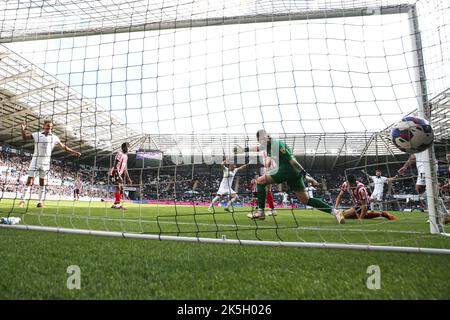 Swansea, UK. 08th Oct, 2022. Anthony Patterson, the goalkeeper of Sunderland is beaten as Ollie Cooper of Swansea city (out of pic) scores his teams 1st goal. EFL Skybet championship match, Swansea city v Sunderland at the Swansea.com Stadium in Swansea, Wales on Saturday 8th October 2022. this image may only be used for Editorial purposes. Editorial use only, license required for commercial use. No use in betting, games or a single club/league/player publications. pic by Andrew Orchard/Andrew Orchard sports photography/Alamy Live news Credit: Andrew Orchard sports photography/Alamy Live News