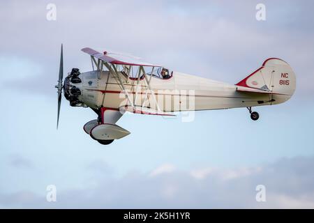 Curtiss-Wright Travel Air 4000 ‘NC 8115’ airborne at the Race Day Airshow held at Old Warden Aerodrome, Shuttleworth on the 2nd October 2022 Stock Photo