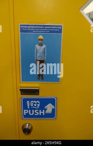Safety and health instructions for factory employees in a food company in Cambodia Stock Photo